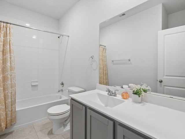 bathroom featuring tile patterned flooring, vanity, toilet, and shower / bath combo with shower curtain