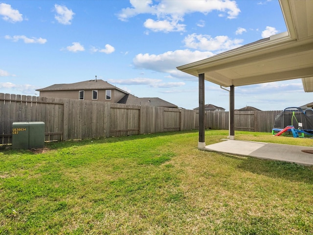 view of yard with a playground, a patio, and a fenced backyard