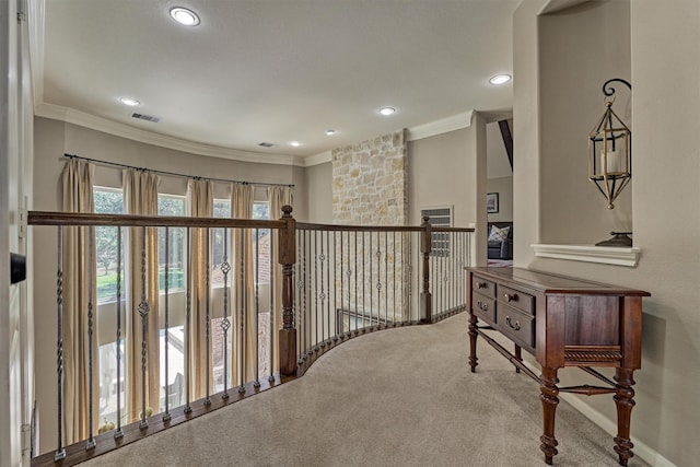 hall with recessed lighting, visible vents, crown molding, and carpet flooring