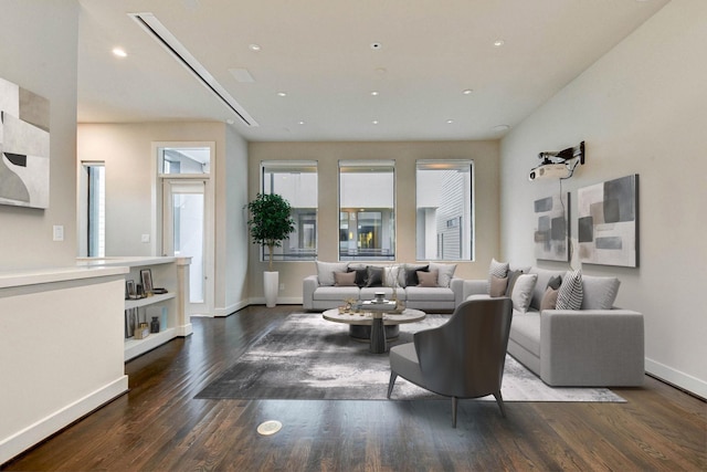 living room with recessed lighting, wood finished floors, and baseboards