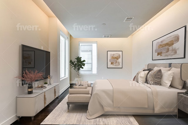 bedroom with visible vents and dark wood finished floors