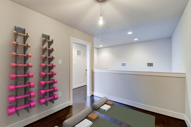 interior space with visible vents and wood finished floors