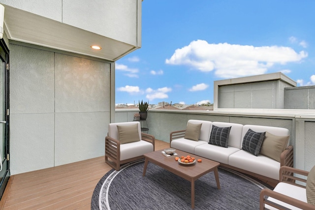 wooden deck featuring an outdoor hangout area