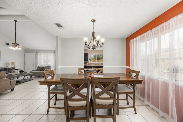 dining space featuring a healthy amount of sunlight, visible vents, and light tile patterned flooring