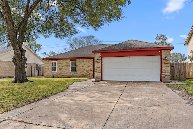 ranch-style house with brick siding, a front yard, fence, a garage, and driveway