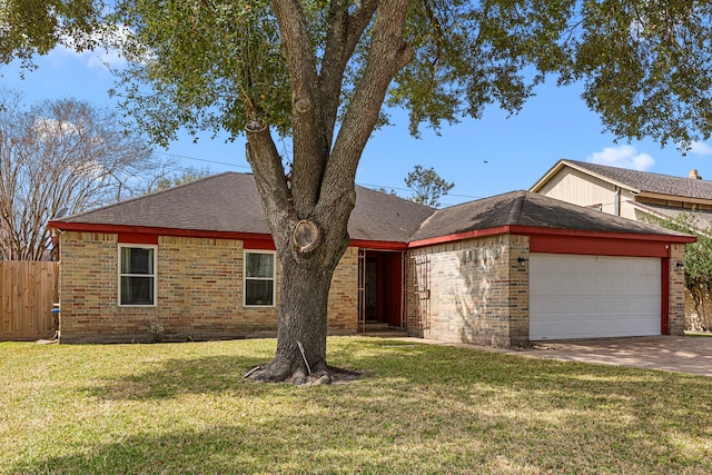 single story home with brick siding, an attached garage, fence, and a front yard