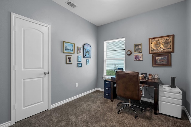 home office featuring dark colored carpet, visible vents, and baseboards