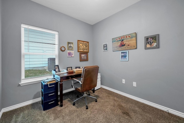 carpeted office space featuring baseboards