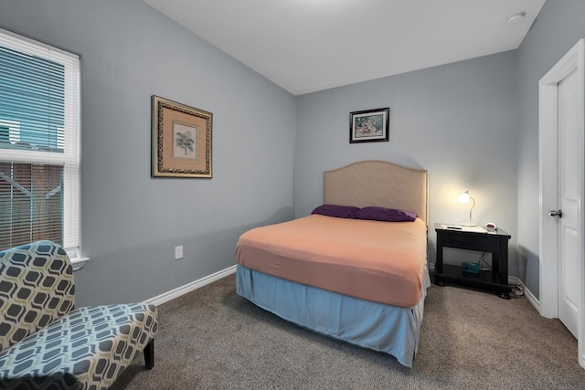 carpeted bedroom with baseboards