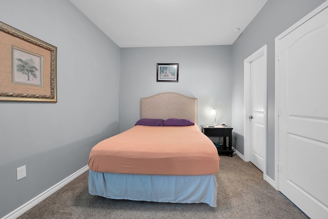 bedroom featuring carpet flooring and baseboards