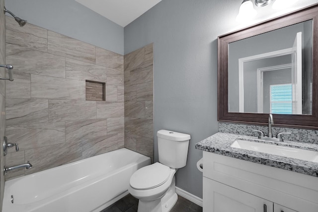 full bath featuring toilet, shower / bath combination, baseboards, and vanity