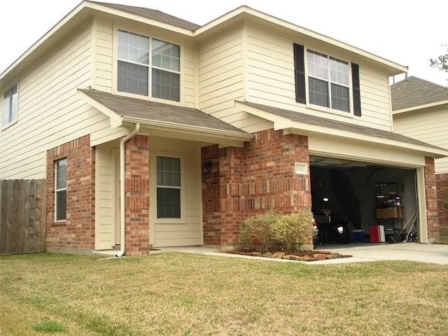 view of front facade with a garage, concrete driveway, brick siding, and fence