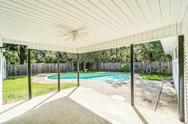 view of swimming pool featuring a patio, a fenced backyard, a ceiling fan, and a fenced in pool