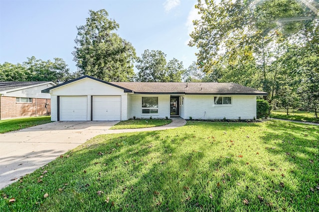 single story home with a garage, driveway, a front lawn, and brick siding