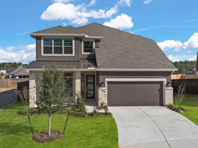 view of front facade with a garage, fence, a front lawn, and brick siding