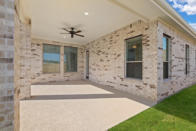 view of patio / terrace featuring ceiling fan