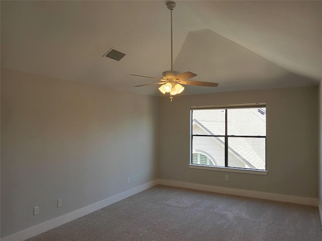 spare room featuring light carpet, baseboards, visible vents, and ceiling fan