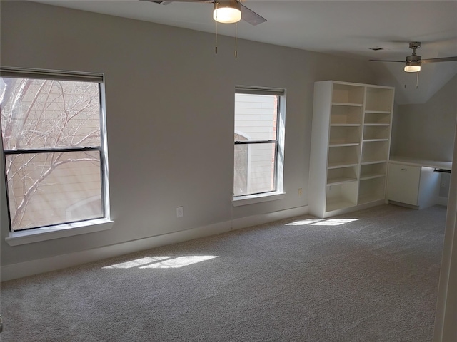 spare room featuring carpet floors and ceiling fan