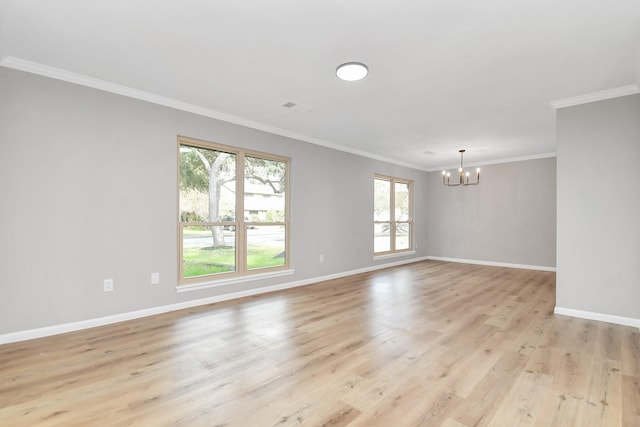 spare room with light wood-style flooring, a notable chandelier, visible vents, baseboards, and ornamental molding