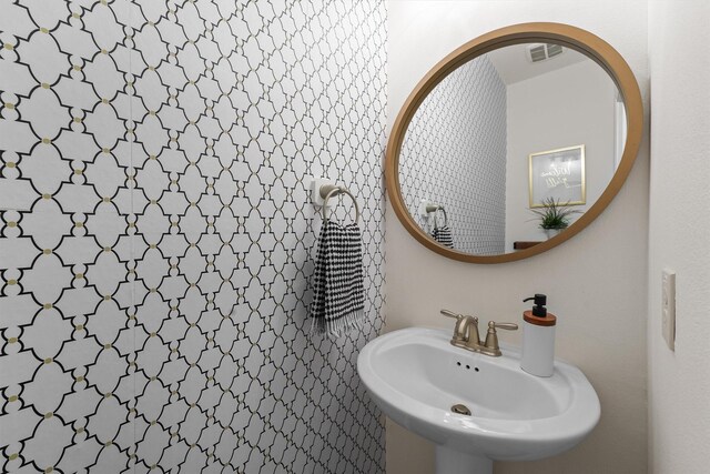 8603 Rexford Cove Ct, Richmond, TX 77407 - bathroom featuring a sink and visible vents