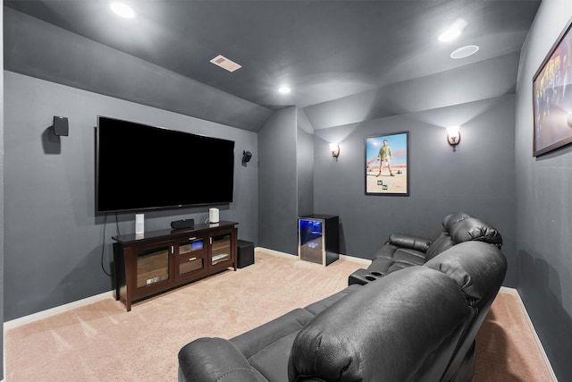 cinema room featuring baseboards, carpet floors, and lofted ceiling