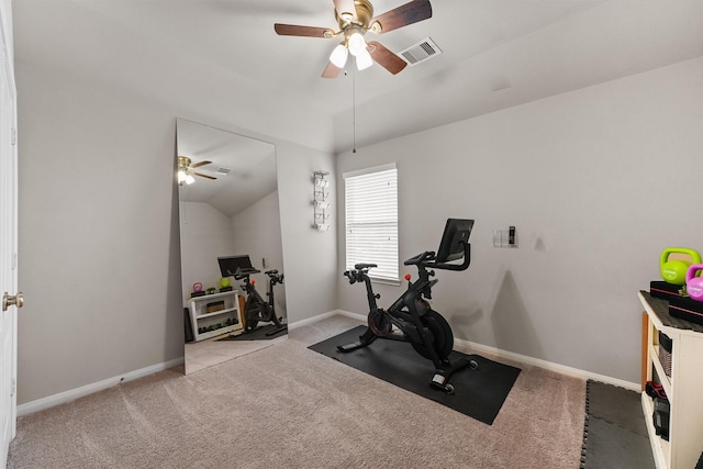 workout area featuring baseboards, visible vents, lofted ceiling, and carpet floors