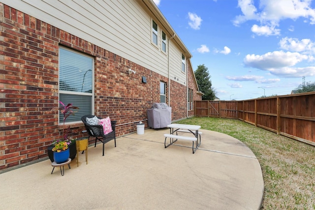 view of patio featuring a fenced backyard and grilling area