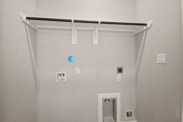 clothes washing area with laundry area, washer hookup, gas dryer hookup, and electric dryer hookup