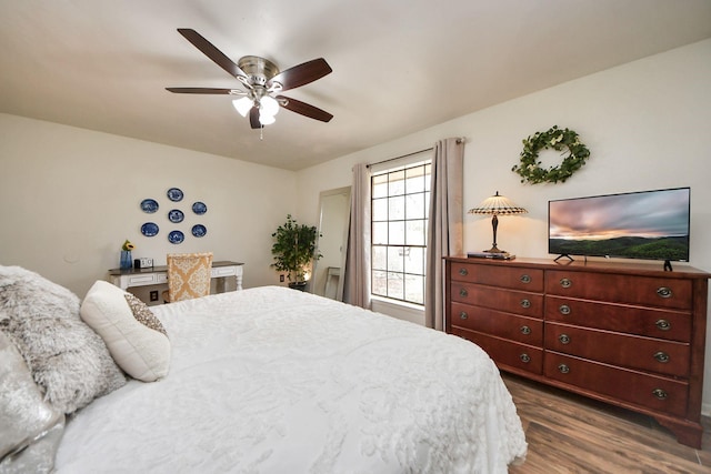 bedroom with dark wood finished floors and a ceiling fan