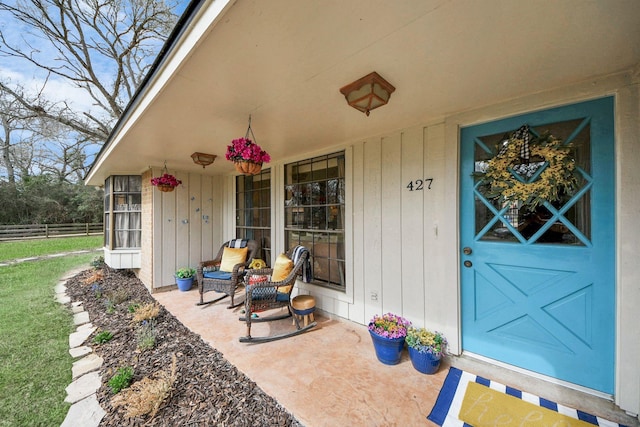 doorway to property featuring covered porch