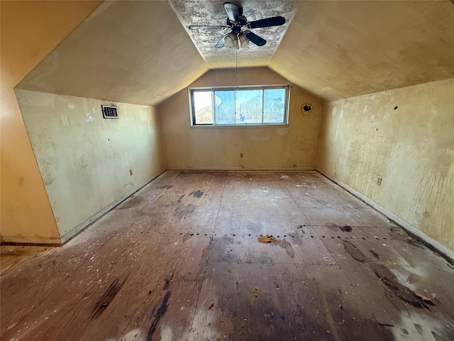 additional living space with visible vents and vaulted ceiling