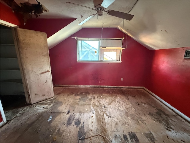 bonus room with ceiling fan and vaulted ceiling