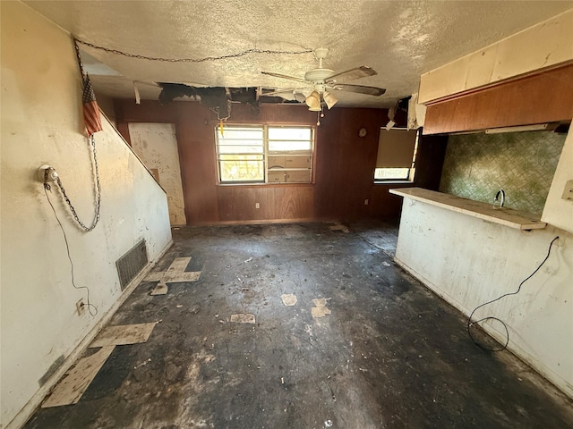 kitchen featuring a textured ceiling and visible vents