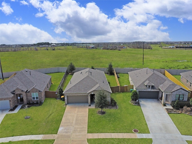 birds eye view of property with a rural view