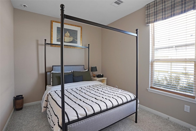 bedroom featuring carpet floors, baseboards, and visible vents