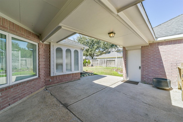 view of patio featuring fence