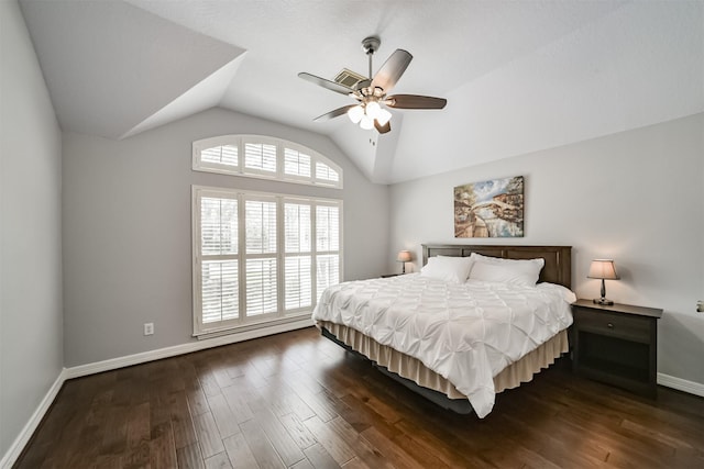 bedroom featuring vaulted ceiling, dark wood-style floors, baseboards, and ceiling fan