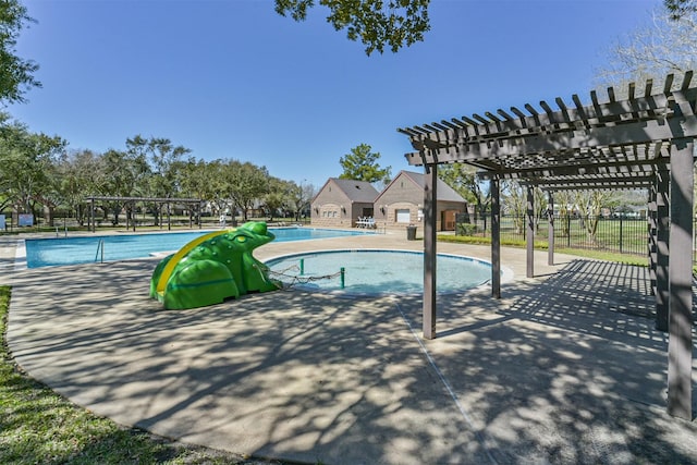 community pool with a patio, fence, and a pergola