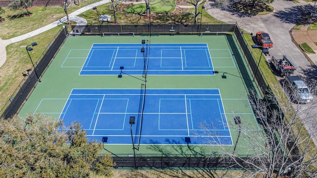 view of sport court with fence