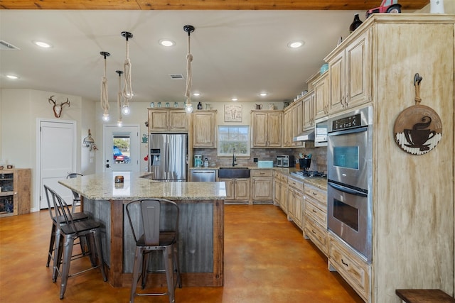 kitchen featuring stainless steel appliances, backsplash, a sink, concrete flooring, and under cabinet range hood