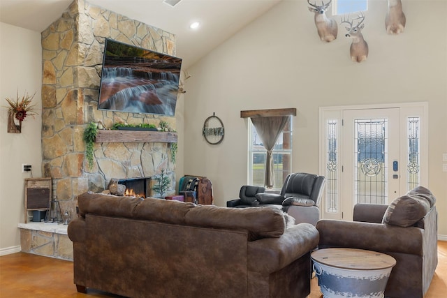 living area with high vaulted ceiling, a fireplace, baseboards, and wood finished floors