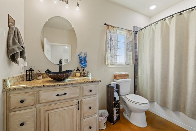 bathroom featuring toilet, shower / bathtub combination with curtain, and vanity