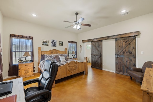 bedroom featuring finished concrete flooring, recessed lighting, visible vents, a barn door, and baseboards