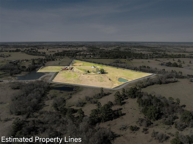 birds eye view of property featuring a rural view