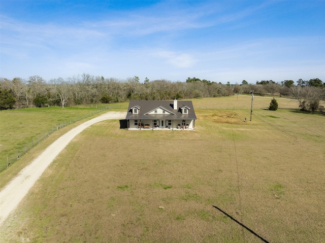 birds eye view of property with a rural view