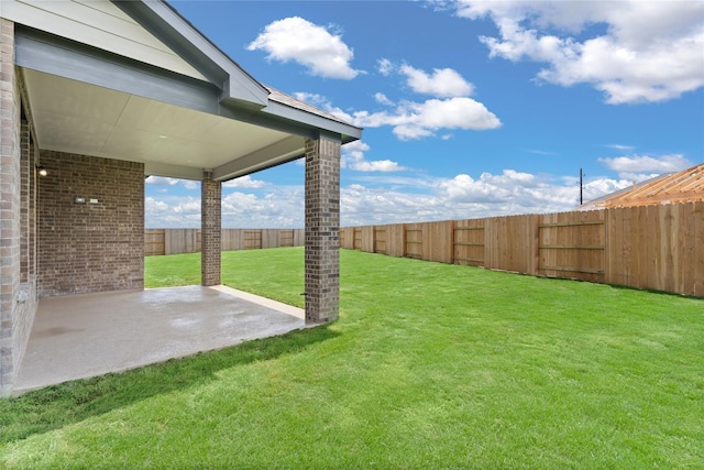 view of yard with a patio and a fenced backyard