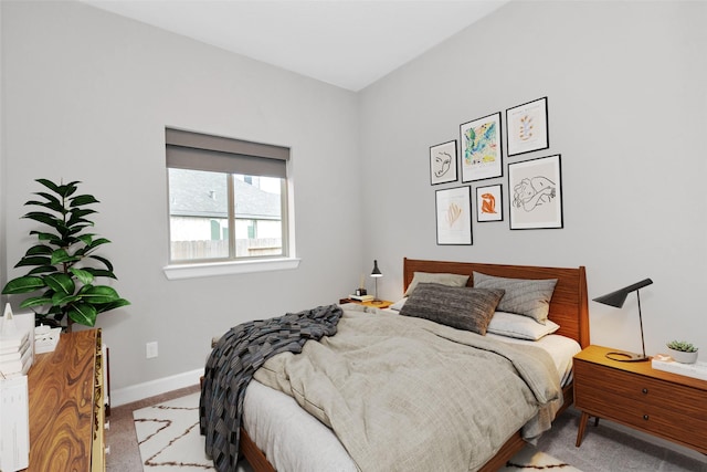 carpeted bedroom with baseboards