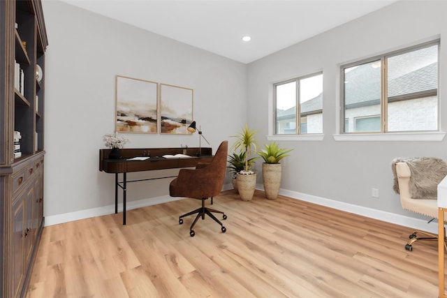 office space featuring light wood-type flooring, baseboards, and recessed lighting