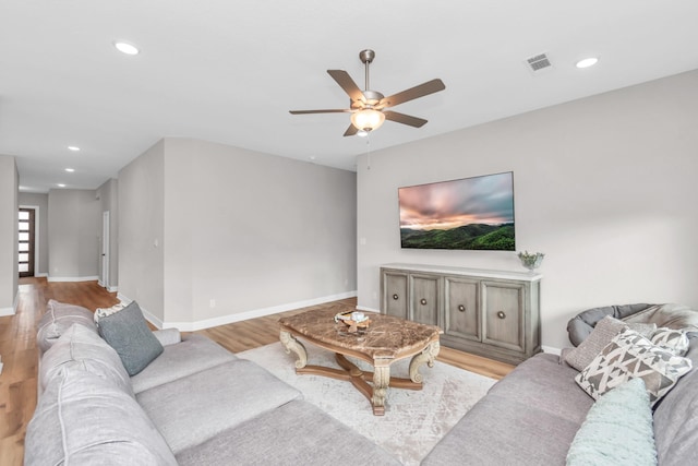 living room with wood finished floors, visible vents, recessed lighting, and a ceiling fan