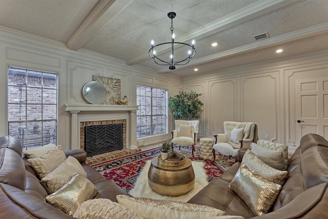 living room with visible vents, a decorative wall, beamed ceiling, and ornamental molding